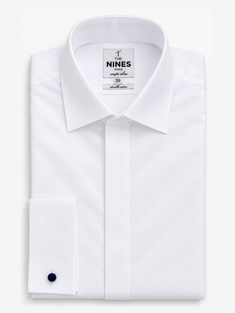 Camicia con polsini doppi bianca con abbottonatura nascosta e collo italiano